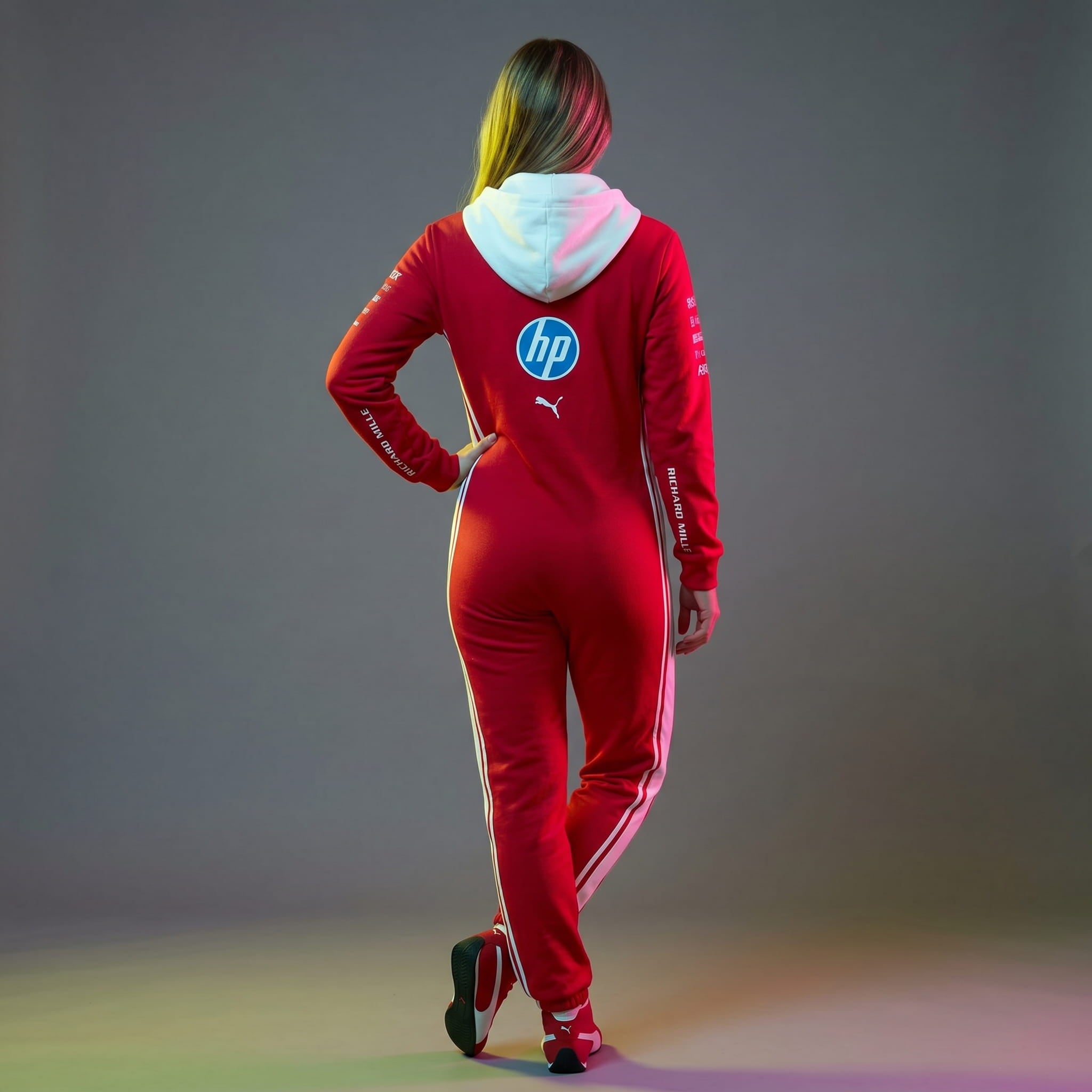 back shot of a female model wearing a ferrari racing suit jumpsuit