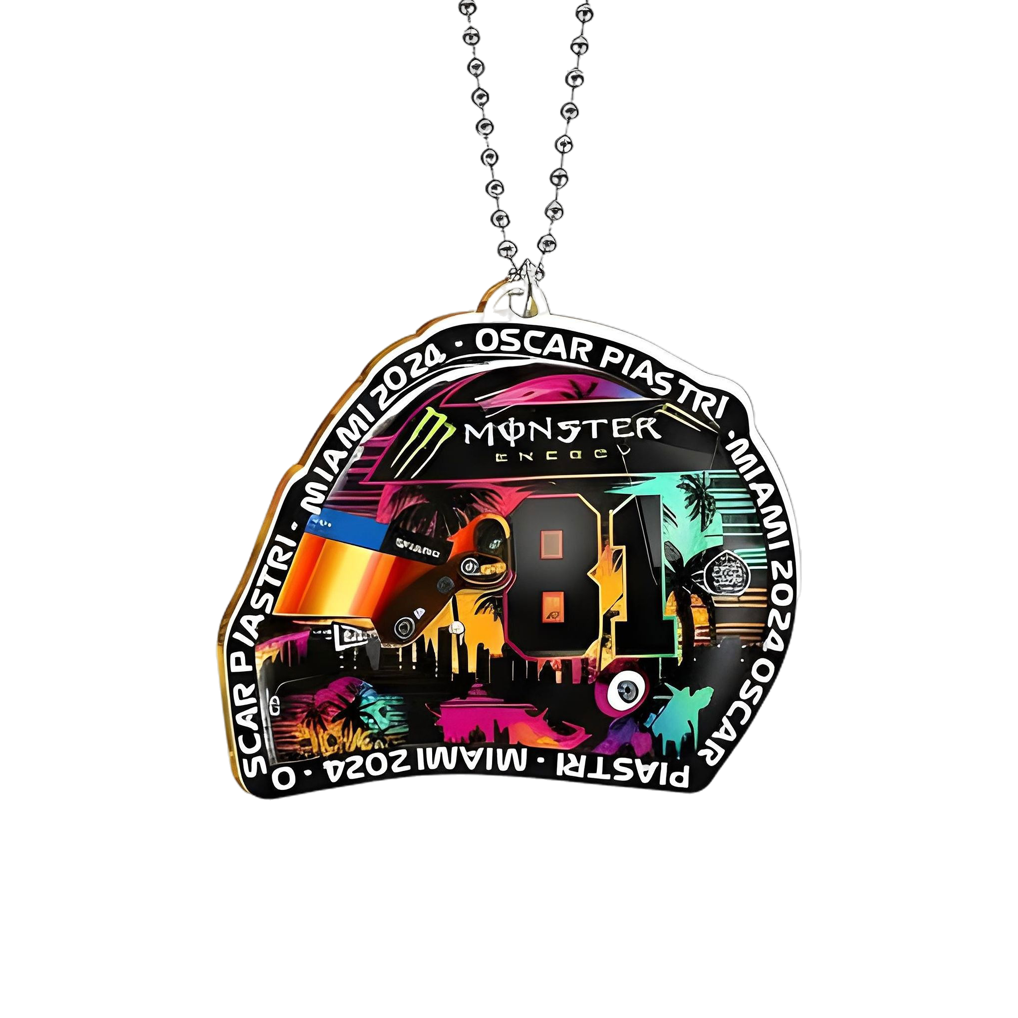 Close-up of Oscar Piastri helmet acrylic ornament showing neon Miami skyline, Monster Energy logo, 81 visor and ball chain